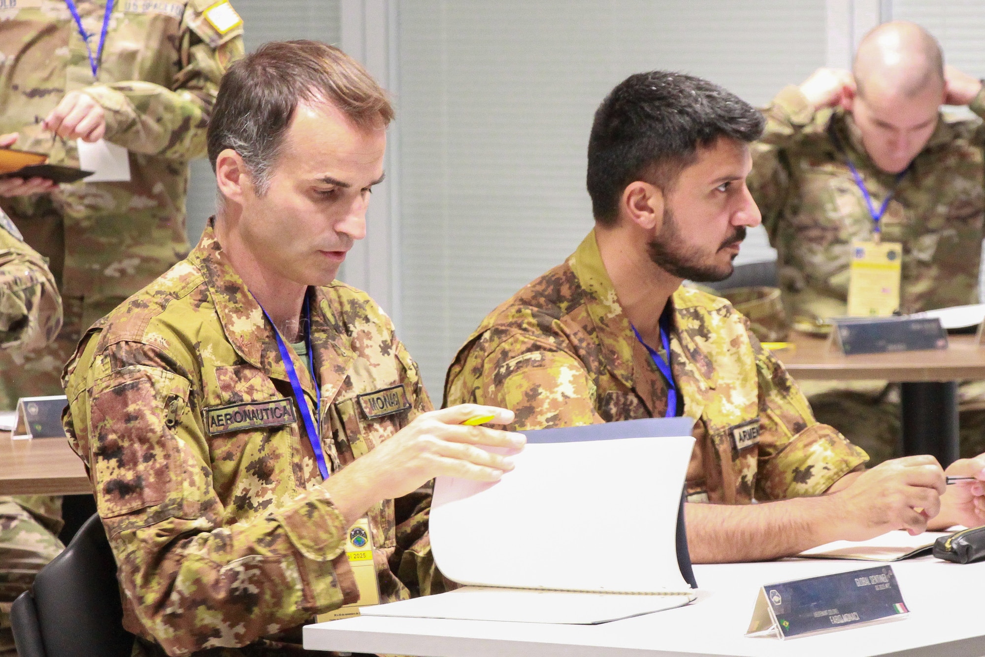 International military members attend a conference on space.