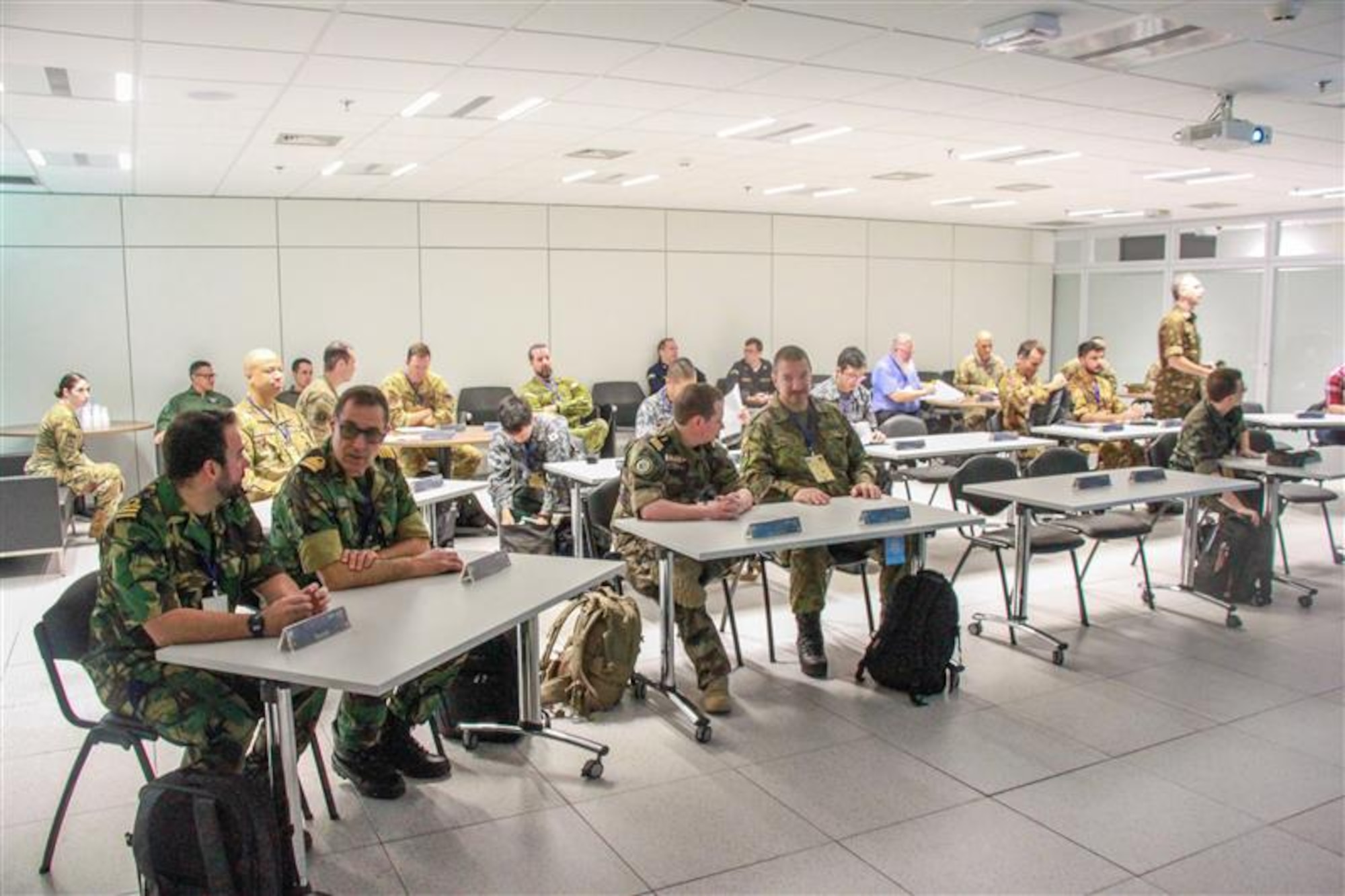 International military members attend a conference on space.
