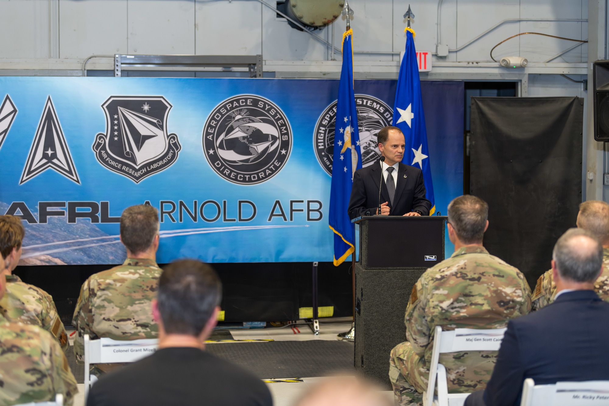 Arnold Engineering Development Complex Senior Technical Director Ed Tucker speaks during the Oct. 2, 2024, ceremony held in the von Kármán Gas Dynamics Facility at Arnold Air Force Base, Tenn., to commemorate the 10th anniversary of the partnership between the AFRL and AEDC. A unit of the Air Force Test Center, AEDC is headquartered at Arnold AFB. The partnership created the AFRL High Speed Aerodynamics Branch, which focuses on hypersonic research, at Arnold. (U.S. Air Force photo by Keith Thornburgh)