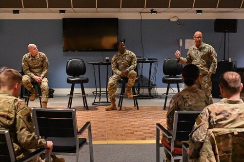 Military members gather for a meeting.