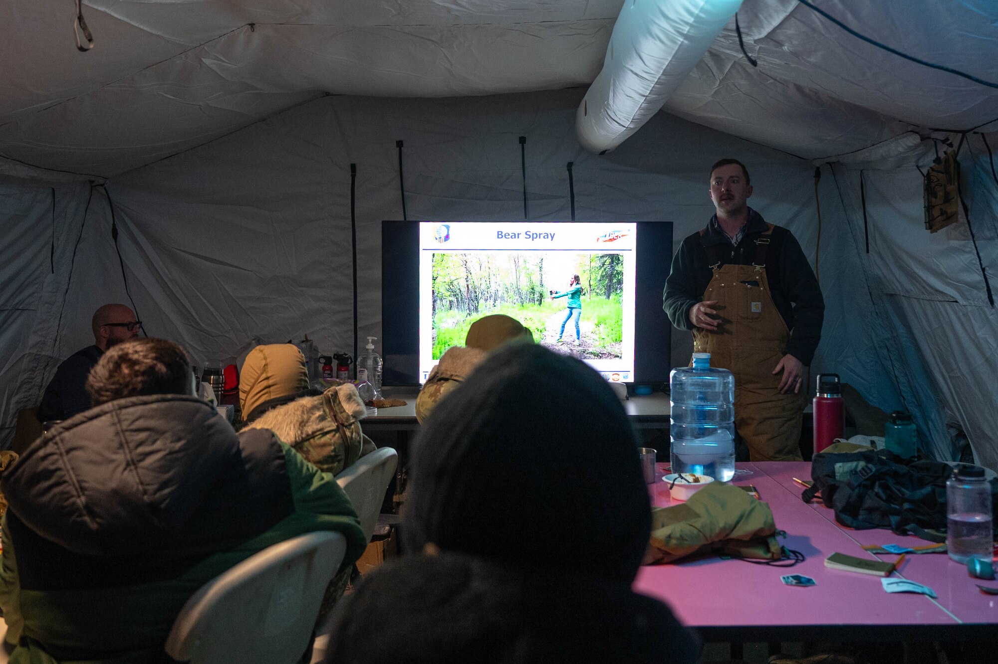 U.S. Air Force Master Sgt. Charles Wood, 354th Fighter Wing Arctic Resiliency program manager, teaches students about wildlife in Alaska and how to properly defend against them at Eielson Air Force Base, Alaska, Nov. 18, 2024.