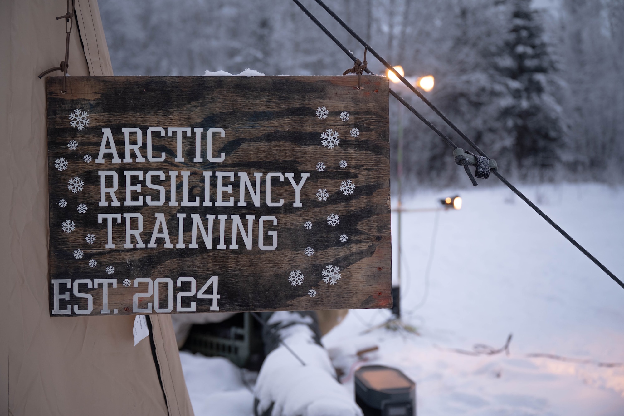 The Arctic Resiliency Training sign hangs outside the course's main tent at Eielson Air Force Base, Alaska, Nov. 18, 2024.