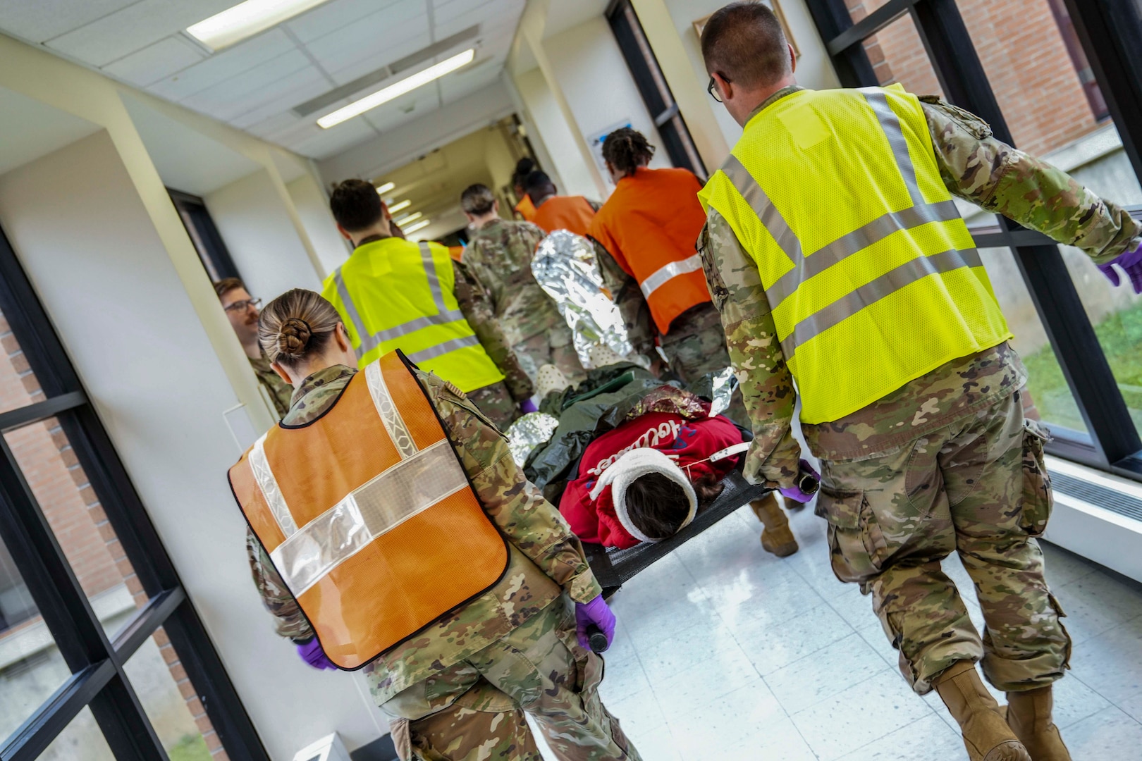 A patient is transported to the final receiving area during a mass casualty decontamination drill conducted at Robins Air Force Base, Georgia, Nov. 20, 2024.