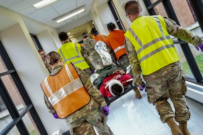 A patient is transported to the final receiving area during a mass casualty decontamination drill conducted at Robins Air Force Base, Georgia, Nov. 20, 2024.