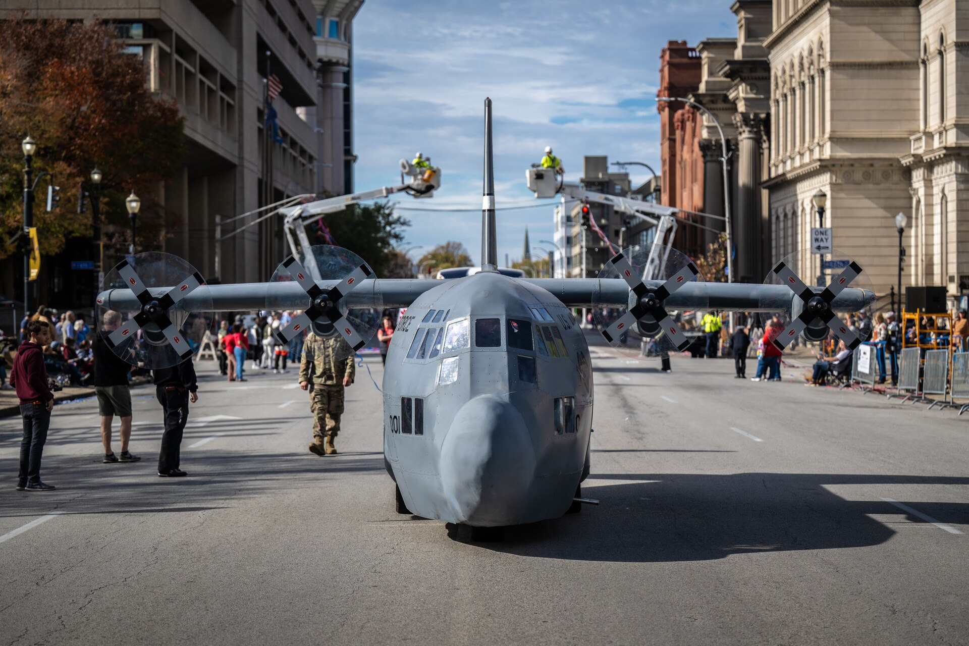 The Kentucky Air National Guard’s Mini C-130 taxies along Jefferson Street in downtown Louisville, Ky., Nov. 9, 2024, as part of the city’s annual Veterans Day Parade. The non-flying scale replica of a C-130 Hercules transport aircraft was fabricated by Airmen from the unit’s 123rd Maintenance Group.
