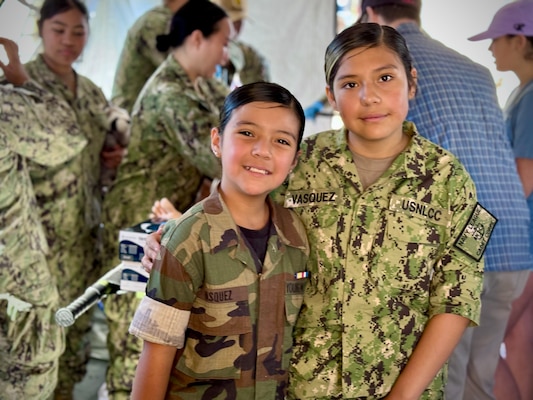 SAN DIEGO (Sept. 30, 2024) Thousands of airshow spectators, such as Amber (R) and Cristal (L), had the opportunity to witness the expeditionary capabilities of Navy Medicine encapsulated in a mobile medical tent filled with cutting-edge medical simulation equipment at Marine Corps Air Station Miramar’s ‘America’s Airshow.'  The expeditionary medical component at an air show is an unexpected, but highly attractive one that draws crowds of young spectators interested in learning more about the nature of Navy Medicine and its corresponding career fields.  The mission of NMCSD is to prepare service members to deploy in support of operational forces, deliver high quality health care services, and shape the future of military medicine through education, training, and research.  NMCSD employs more than 5,000 active-duty military personnel, civilians and contractors in southern California to provide patients with world-class care. Anchored in Excellence, Committed to Health!