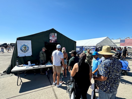 SAN DIEGO (Sept. 30, 2024) Thousands of airshow spectators had the opportunity to witness the expeditionary capabilities of Navy Medicine encapsulated in a mobile medical tent filled with cutting-edge medical simulation equipment at Marine Corps Air Station Miramar’s ‘America’s Airshow.'  The expeditionary medical component at an air show is an unexpected, but highly attractive one that draws crowds of young spectators interested in learning more about the nature of Navy Medicine and its corresponding career fields.  In this photo spectators line up to enter the medical STEM tent.  The mission of NMCSD is to prepare service members to deploy in support of operational forces, deliver high quality health care services, and shape the future of military medicine through education, training, and research.  NMCSD employs more than 5,000 active-duty military personnel, civilians and contractors in southern California to provide patients with world-class care. Anchored in Excellence, Committed to Health!