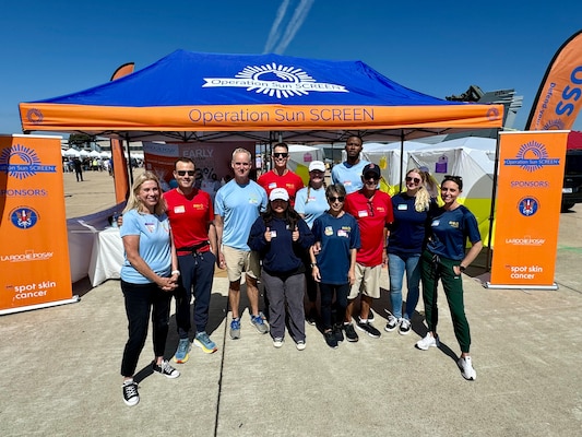 SAN DIEGO (Sept. 30, 2024) Thousands of airshow spectators had the opportunity to witness the expeditionary capabilities of Navy Medicine encapsulated in a mobile medical tent filled with cutting-edge medical simulation equipment and free skin cancer screenings at Marine Corps Air Station Miramar’s ‘America’s Airshow.'  “The Association of Military Dermatologists (AMD)—in conjunction with partners LaRoche Posay and the American Academy of Dermatology's 'Spot Skin Cancer' campaign—and a dedicated team of volunteer dermatologists, residents, and corpsmen from NMCSD, supported AMD’s Operation Sun SCREEN, whose mission is offer free skin cancer screenings during the three day Air Show and to ensure sun screen was available in ample quantities for spectators,” said LCDR Willis Lyford, NMCSD staff dermatologist.  In this photo volunteers gather for a group photo.  The mission of NMCSD is to prepare service members to deploy in support of operational forces, deliver high quality health care services, and shape the future of military medicine through education, training, and research.  NMCSD employs more than 5,000 active-duty military personnel, civilians and contractors in southern California to provide patients with world-class care. Anchored in Excellence, Committed to Health!