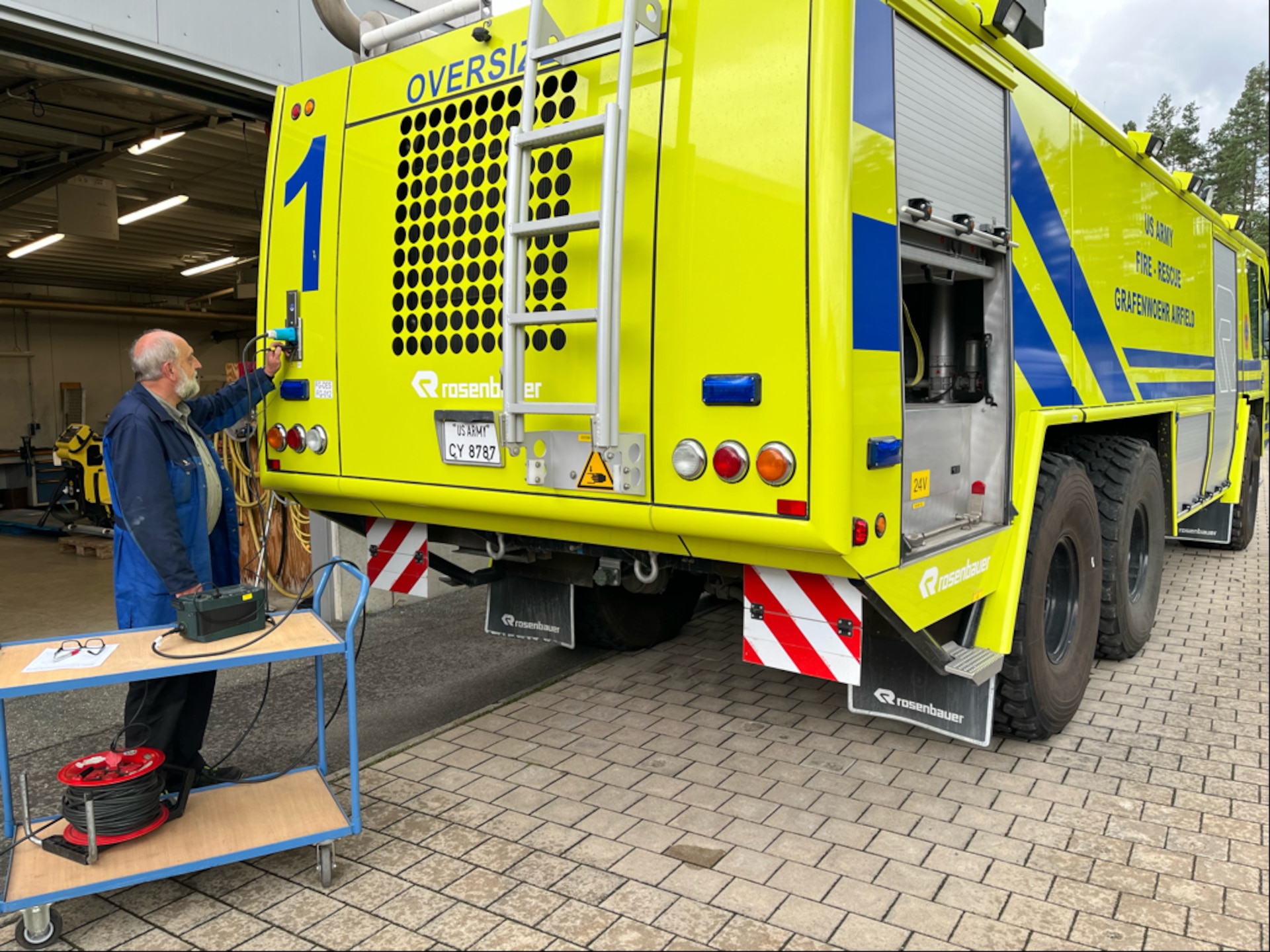 Robert Reindl conducts electrical testing on a U.S. Army Garrison Bavaria fire truck at Tower Barracks in Grafenwöhr, Germany, Sept. 27. The German local national U.S. Army employee and electrical equipment repair inspector with Base Support Operations Maintenance is set to retire Dec. 1 after more than 35 years with the Army. (Stefan Pfister)