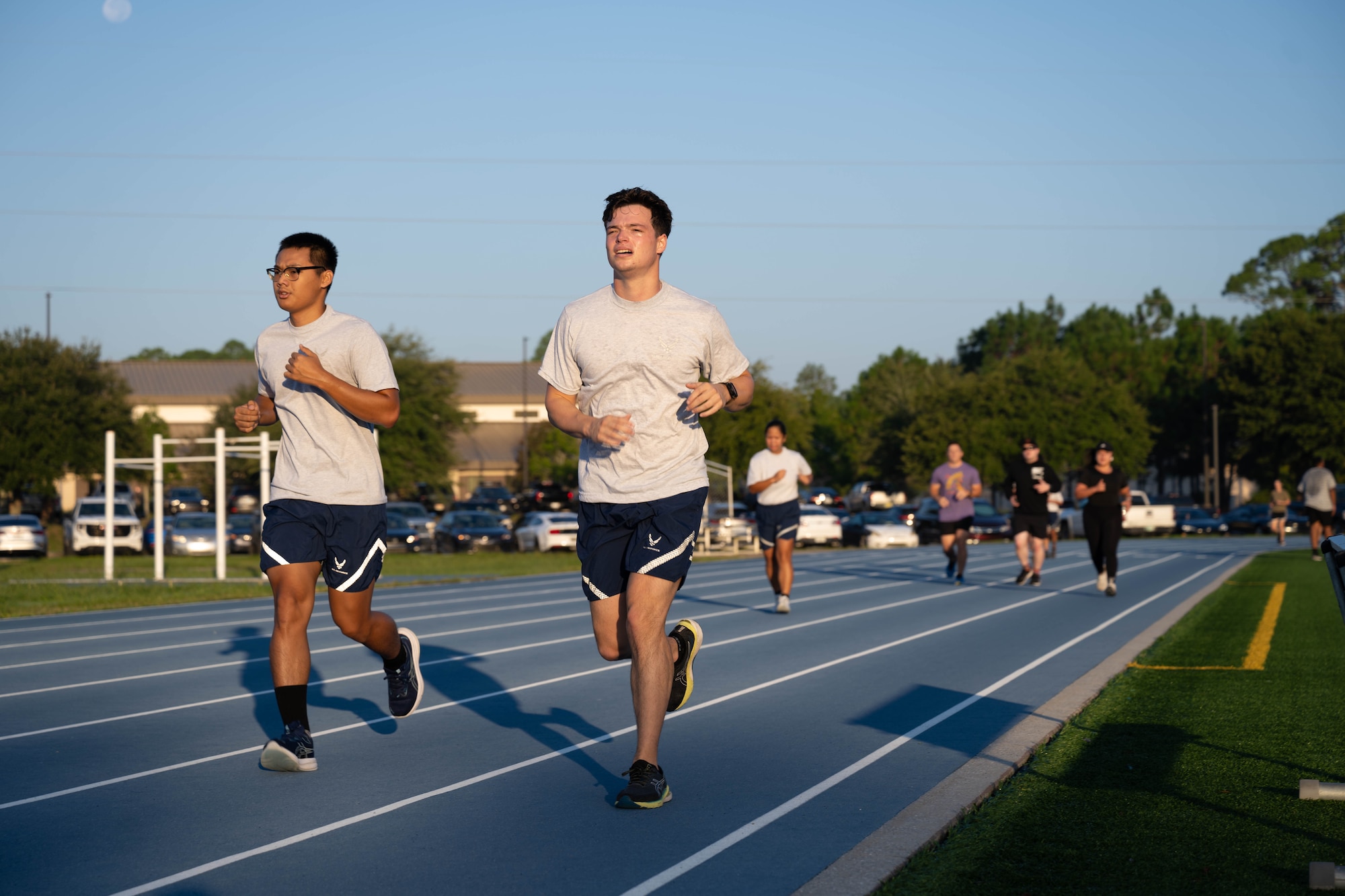 U.S. Air Force Airman 1st Class Ta Blut Htoo, left, and Airman 1st Class James Fiore, both force management technicians assigned to the 1st Special Operations Force Support Squadron, participate in the POW/MIA 24-hour vigil run at the Aderholt Fitness Center track at Hurlburt Field, Florida, Sept. 19, 2024.