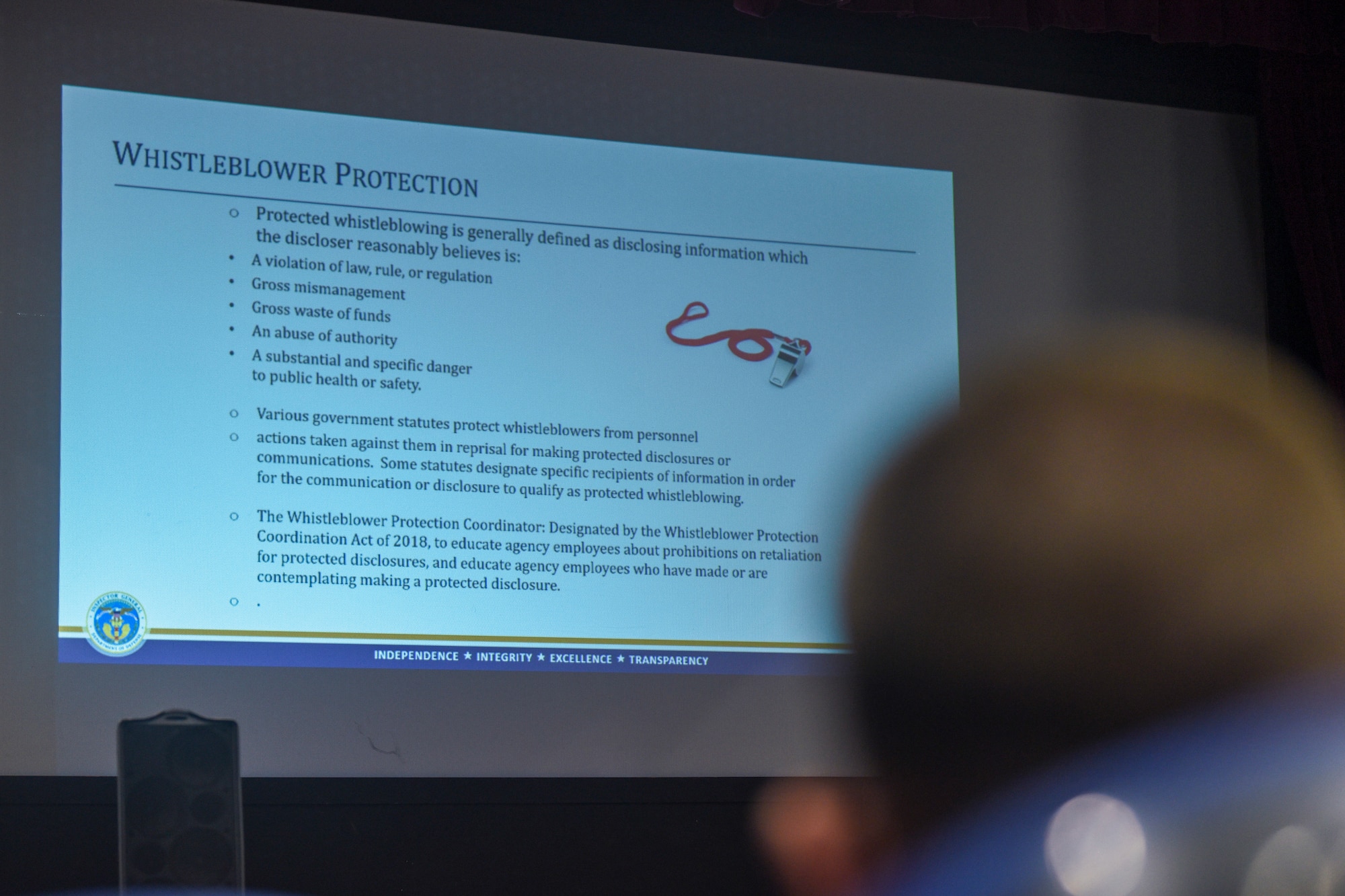A slide on whistleblower protections is displayed during  a briefing given by Kenneth Sharpless, Department of Defense Whistleblower Protection Coordinator, at Royal Air Force Mildenhall, England, Sept. 18, 2024.