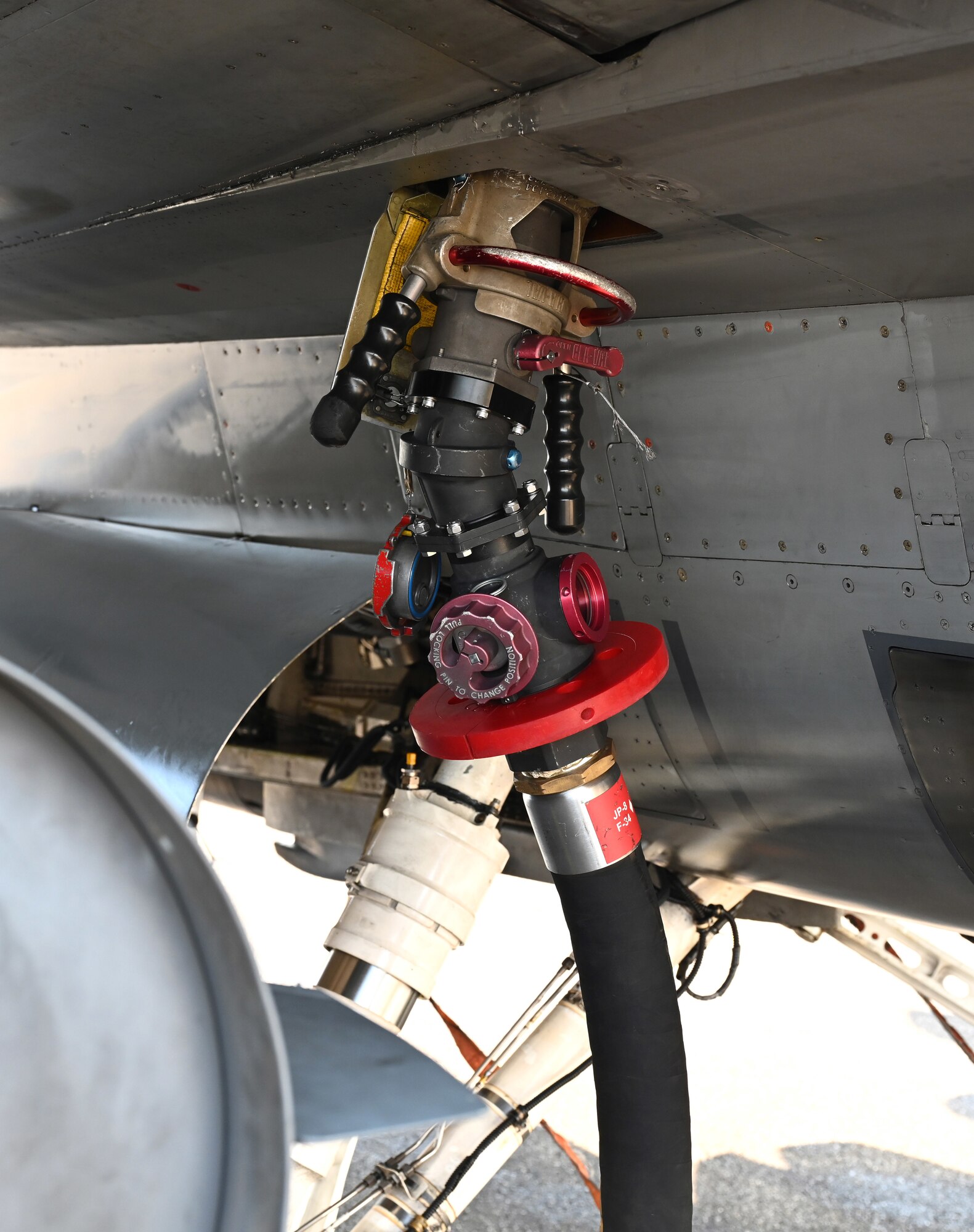 A hose from an R-11 Refueler truck is connected to an F-16 Fighting Falcon from Aviano Air Base, Italy, at Royal Air Force Mildenhall, England, Sept. 19, 2024.