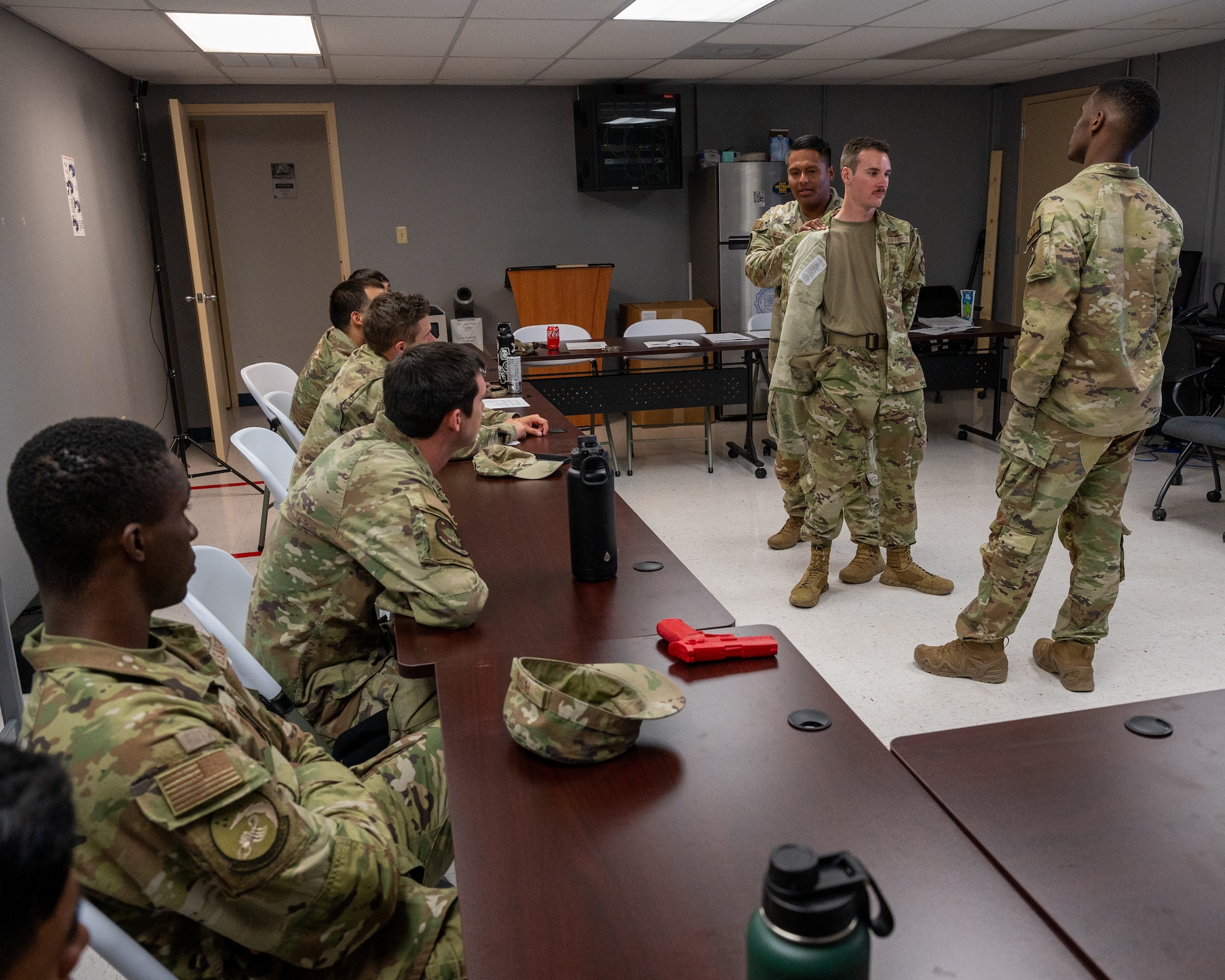 U.S. Air Force Airmen from the 47th Security Forces Squadron demonstrate the correct technique to search a suspect, at Laughlin Air Force Base, Texas, Aug. 20, 2024. While training, augmentees learn skills that will enable them to provide extra help to Laughlin Defenders. (U.S. Air Force photo by Staff Sgt. Nicholas Larsen)