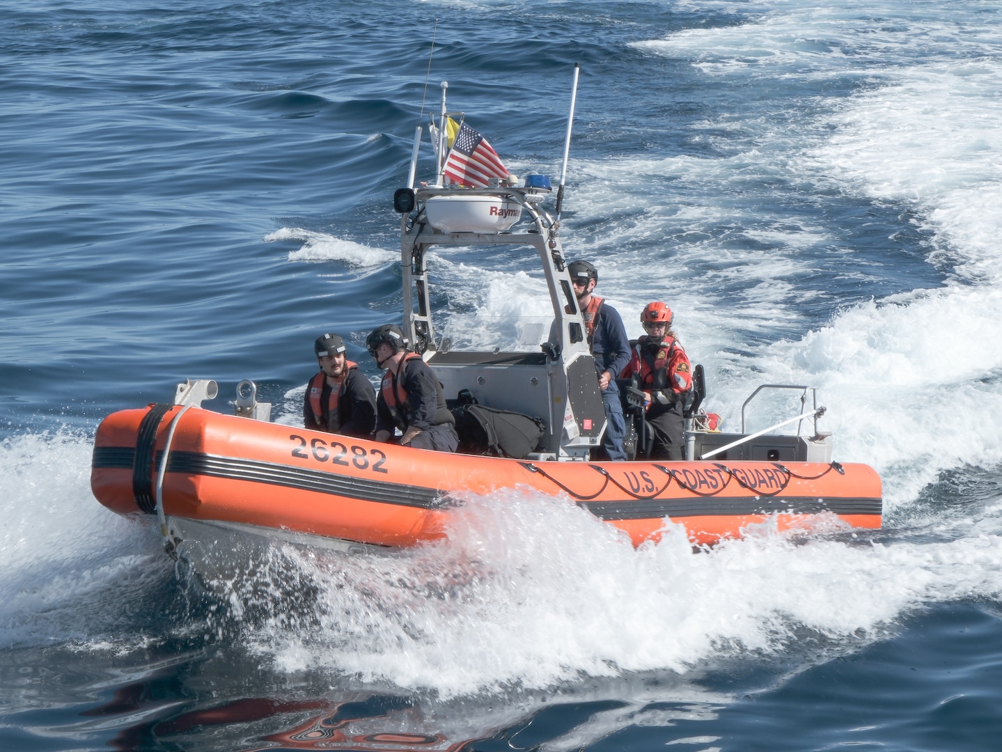 Coast Guard Cutter Northland (WMEC 904) crew members and Canadian Department of Fisheries and Oceans fishery officer Elizabeth Brennan make way aboard the Northland’s Over the Horizon small boat to conduct a Northwest Atlantic Fisheries Organization (NAFO) boarding, Aug. 31, 2024, while underway in the Atlantic Ocean. NAFO is a group of sovereign countries committed to the safety and securing of fisheries across the region. (U.S. Coast Guard photo by Petty Officer 3rd Class Anthony Randisi)