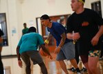Lt. Col. Jeremiah Alefosio, 30th Logistics Readiness Squadron commander, dribbles the basketball toward his opponent during a 30 LRS sports day event at Vandenberg Space Force Base, Calif., Sept. 26, 2024. The squadron held a morale day full of sports events, including basketball, soccer, and ultimate frisbee. (U.S. Space Force photo by Senior Airman Ryan Quijas)