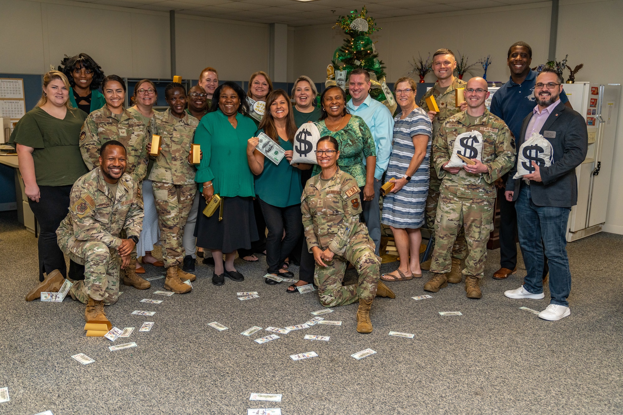 Airmen and civilians assigned to the 81st Comptroller Squadron pose for a group photo during the 81st CPTS Fiscal Year Close Out at Keesler Air Force Base, Mississippi, Sept. 30, 2024. The purpose of the close out was to execute 100% of Keesler’s funding to maximize buying power. (U.S. Air Force photo by Andrew Young)