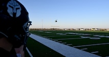 A UH-1 Iroquois assigned to the 54th Helicopter Squadron prepares to land at Sentinel Stadium after the National Anthem of a Minot North High School football game, Minot, North Dakota, Sept. 27, 2024. As part of the pre-game ceremonies the 54th HS performed a fly-over and delivered 91st Missile Wing leadership to give the game ball to officials at the start of the game. (U.S. Air Force photo by Tech. Sgt. Rusty Frank)