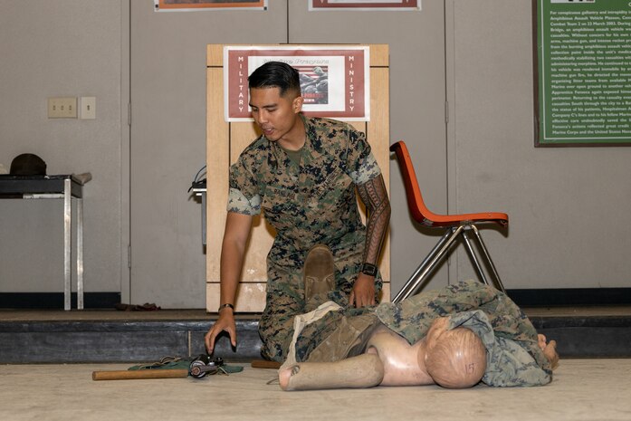 U.S. Marine Corps Sgt. Ezra Banlaoi, a drill instructor with Support Battalion, Recruit Training Regiment, instructs recruits with Golf Company, 2nd Recruit Training Battalion, during a tactical combat casualty care class at Marine Corps Recruit Depot San Diego, California, Sept. 17, 2024. Recruits receive multiple periods of instruction on casualty care and the importance of ensuring the appropriate medical care is given at the correct time and place when necessary. (U.S. Marine Corps photo by Lance Cpl. Janell B. Alvarez)