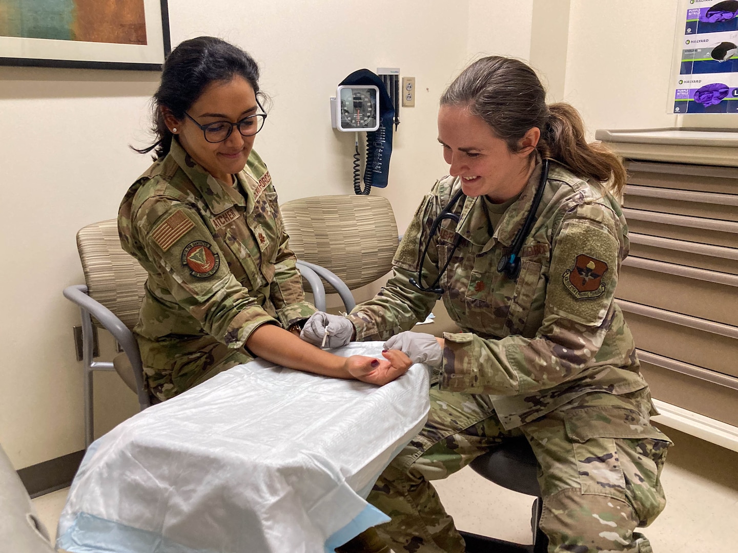 Maj. Lauren Gabreski, an allergist and immunologist with the 48th Healthcare Operations Squadron, demonstrates an allergy skin prick test at the Allergy and Immunizations Clinic at Wilford Hall Ambulatory Surgical Center, Joint Base San Antonio-Lackland, Texas, on June 25, 2024. Now stationed at Royal Air Force Lakenheath, Gabreski continues her family's long tradition of military service, striving to inspire the next generation of airmen through her leadership and dedication to military healthcare. (U.S. Air Force photo by Senior Airman Melody Bordeaux)