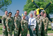 Allergy and immunology staff, along with fellows from the Allergy and Immunology Fellowship at Wilford Hall Ambulatory Surgical Center, pose for a photo at the Lackland Parade Field, Joint Base San Antonio-Lackland, Texas, in June 2024. Among them is Maj. Lauren Gabreski, whose path to becoming an Air Force allergist and immunologist began with an interest in pediatric care. After serving as a general pediatrician for four years, she participated in an Allergy Extender Program, where she discovered her passion for allergy and immunology, ultimately pursuing specialized training in the field. (U.S. Air Force photo by Daniel Steigelman)