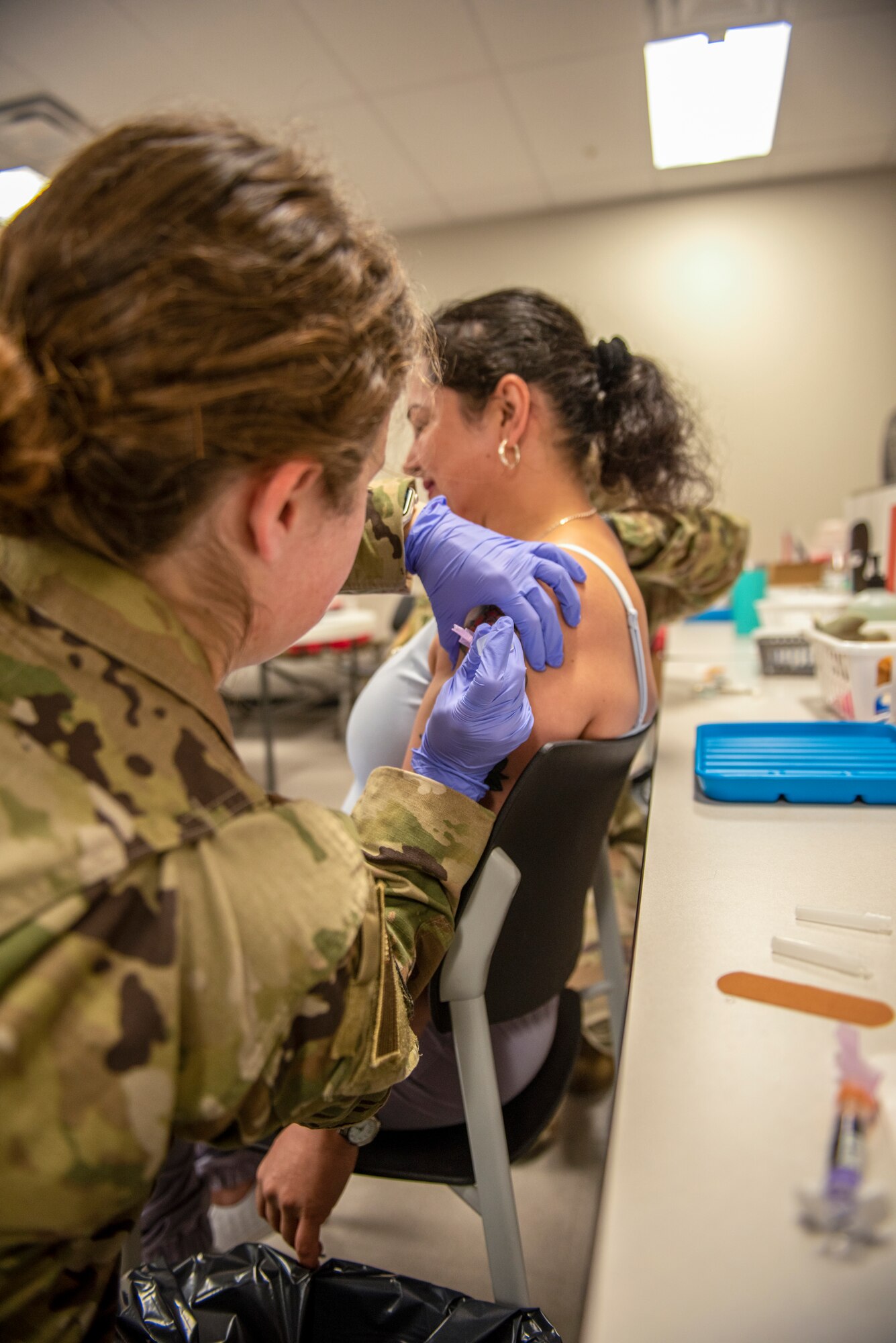 Woman gives vaccine