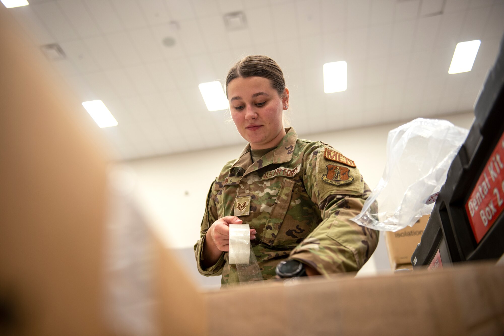Woman packages boxes