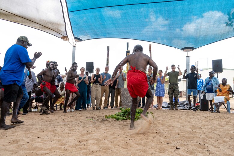 Pirrawayingi, center, a Munupi elder, leads U.S. Marines, families of the fallen, and members of the Australian Defence Force in a dance during a Pukumani ceremony hosted by the Tiwi Island-Mantiyupwi clan, in collaboration with the Larrakia Nation Aboriginal Corporation, at Melville Island, Tiwi Islands, Australia, Sept. 27, 2024. The Pukumani Ceremony is a traditional Tiwi people ritual that honors the deceased and helps guide their spirits to the afterlife, marking the official end of mourning. For the first time, U.S. Marines and family members of the fallen were honored by the Tiwi and Larrakia people during the week leading up to two culturally significant ceremonies: a healing ceremony and a Pukumani ceremony. These ceremonies commemorated the three U.S. Marines who tragically lost their lives in a U.S. Marine Corps MV-22B Osprey crash on Melville Island on Aug. 27, 2023. (U.S. Marine Corps photo by Gunnery Sgt. Kassie McDole)