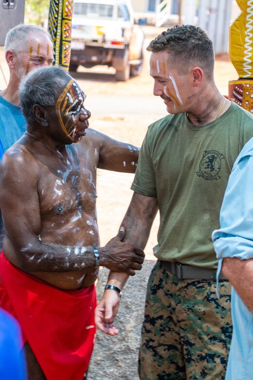 Pirrawayingi, left, a Munupi Clan elder, welcomes U.S. Marine Corps Capt. Chase Cooke, the husband of Capt. Eleanor LeBeau, to the Tiwi Island family during a Pukumani ceremony hosted by the Tiwi Island-Mantiyupwi clan, in collaboration with the Larrakia Nation Aboriginal Corporation, at Melville Island, Tiwi Islands, Australia, Sept. 27, 2024. The Pukumani Ceremony is a traditional Tiwi people ritual that honors the deceased and helps guide their spirits to the afterlife, marking the official end of mourning. For the first time, U.S. Marines and family members of the fallen were honored by the Tiwi and Larrakia people during the week leading up to two culturally significant ceremonies: a healing ceremony and a Pukumani ceremony. These ceremonies commemorated the three U.S. Marines who tragically lost their lives in a U.S. Marine Corps MV-22B Osprey crash on Melville Island on Aug. 27, 2023. (U.S. Marine Corps photo by Gunnery Sgt. Kassie McDole)