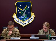 U.S. Air Force Col. George Chapman, 91st Missile Wing commander and Lt. Col. Karrie Wray, 576th Flight Test Squadron director of operations, confirm the safety checklist during the simulated electronic launch of a Minuteman III (SELM) at Minot Air Force Base, North Dakota, Sept. 17, 2024. This evaluation is an end-to-end test that is used to verify the reliability of the MMIII intercontinental ballistic missile (ICBM) system’s ability to launch if given the command from a launch control center (LCC) or an airborne launch control system (ALCS). (U.S. Air Force photo by Senior Airman Alexander)