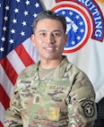 Army Soldier professional head and shoulders photo in front of United States Flag and Army Recruiting flag