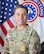 Army Soldier professional head and shoulders photo in front of United States Flag and Army Recruiting flag