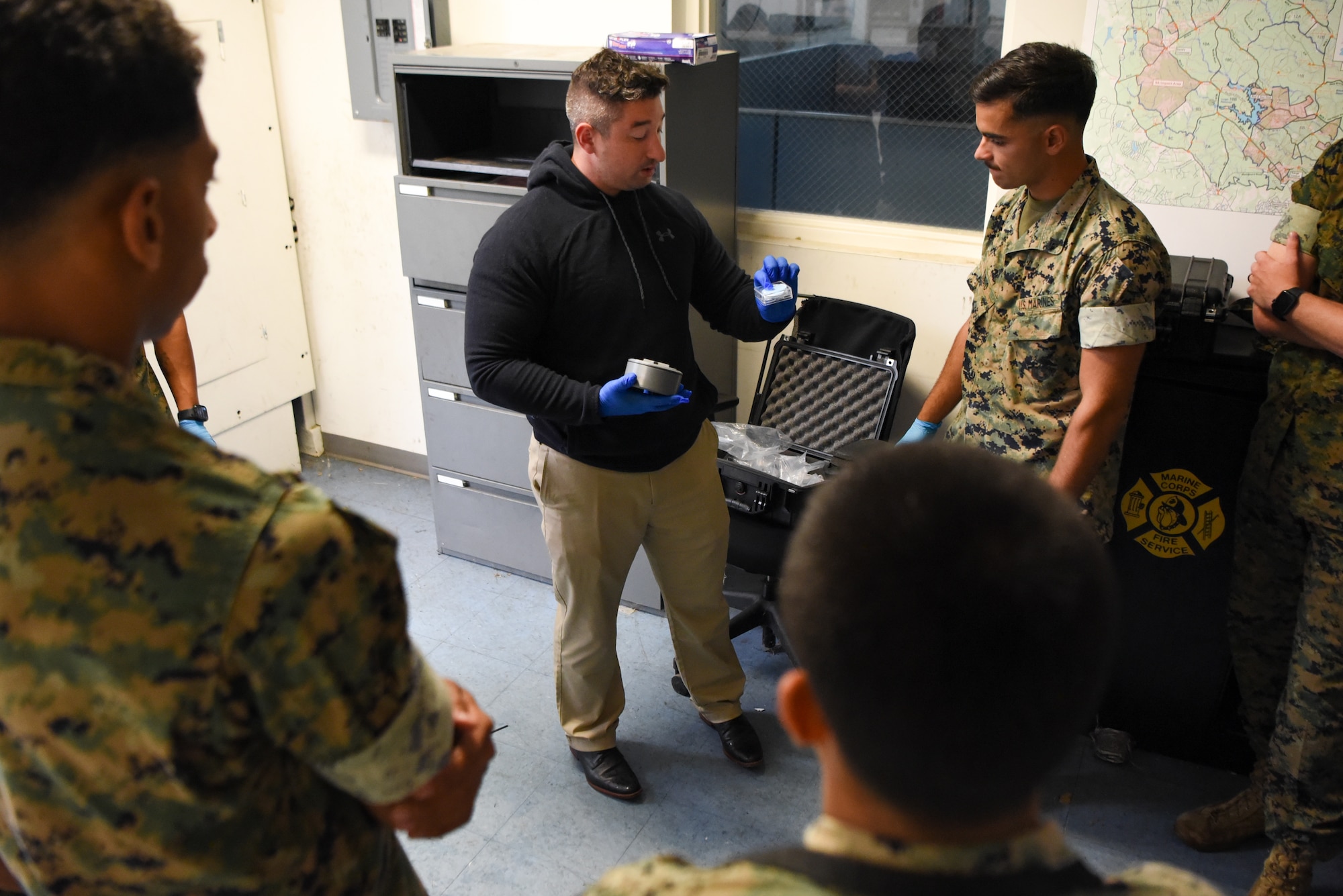U.S. Air Force Staff Sgt. Brandon Trapani, Security Forces Non-commissioned Officer in Charge, Joint Military Working Dog (MWD) Program, trains U.S. Marine MWD Handlers on narcotic training aid prototype capabilities at Marine Corps Base Quantico, Virginia, September 17, 2024. The prototype was developed due to a recent uptick in narcotic training aids returned damaged or inoperable due to various mission-related circumstances. (U.S. Air Force photo by Staff Sgt. Deven Schultz)