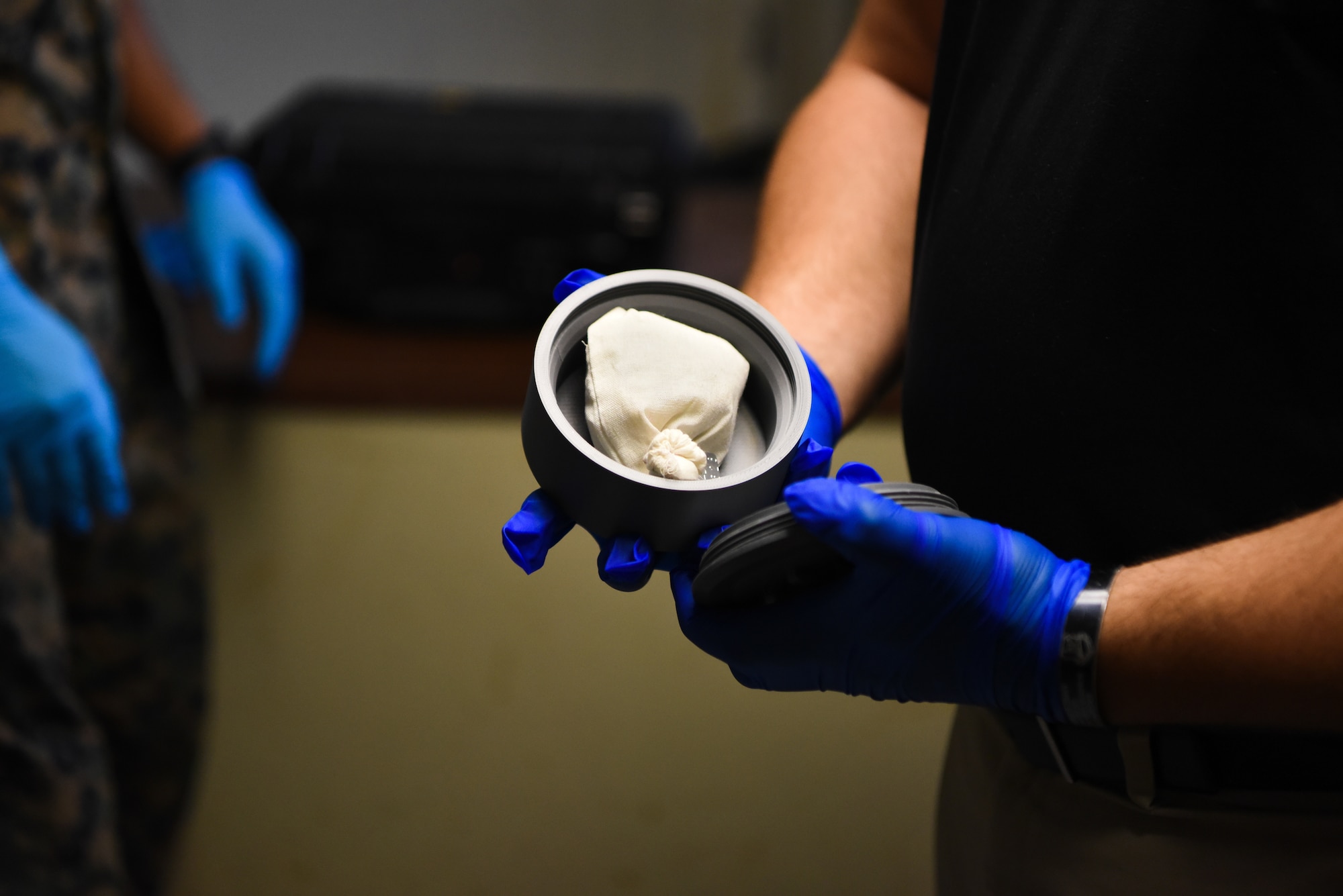 U.S. Air Force Staff Sgt. Brandon Trapani, Security Forces Non-commissioned Officer in Charge, Joint Military Working Dog (MWD) Program, displays a narcotic training aid prototype at Marine Corps Base Quantico, Virginia, September 17, 2024. Staff Sgt. Trapani and the Joint MWD team visited four bases receiving feedback that will help with the prototype’s final size, narcotic odor emission, and portability of the training aid. (U.S. Air Force photo by Staff Sgt. Deven Schultz)