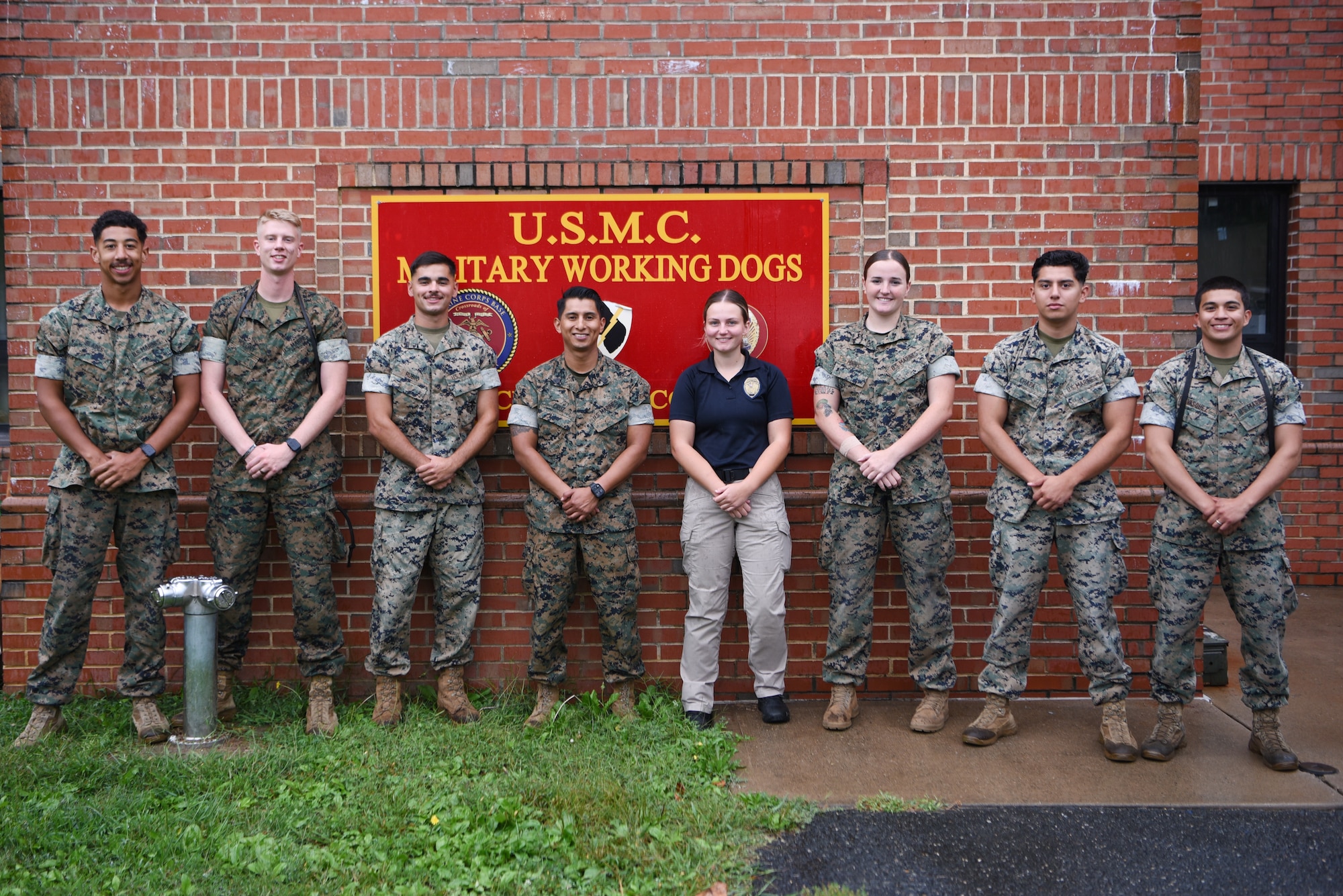 U.S. Marine Corps Military Working Dog handlers are pictured after completing testing of the narcotic training aid prototype at Marine Corps Base Quantico, Virginia, September 17, 2024. (U.S. Air Force photo by Staff Sgt. Deven Schultz)
