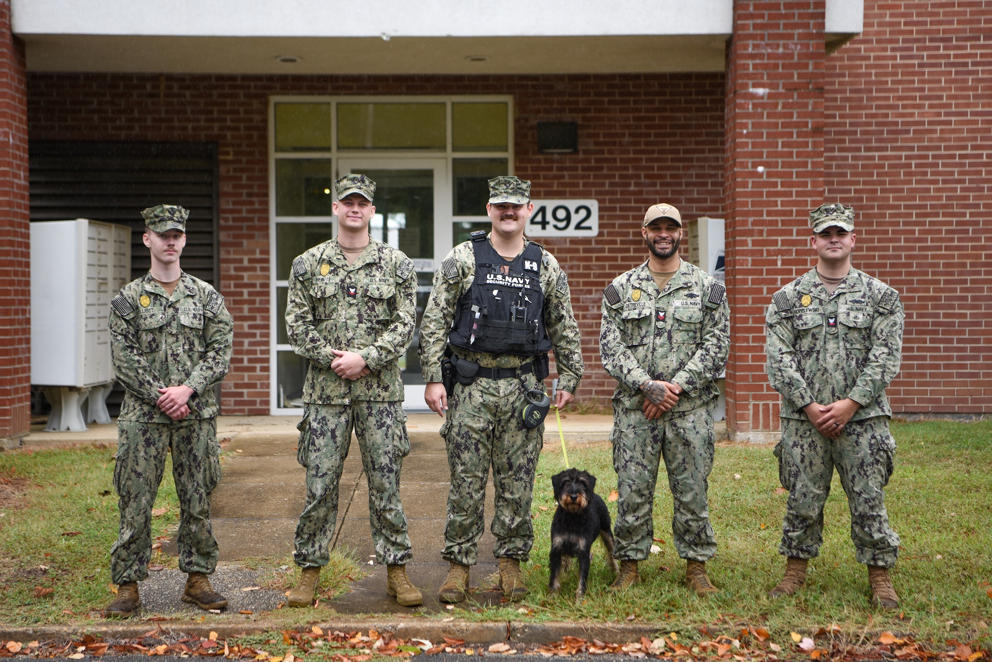 U.S. Navy Military Working Dog handlers are pictured after completing testing of the narcotic training aid prototype at Naval Air Station Patuxent River, Maryland, September 18, 2024. (U.S. Air Force photo by Staff Sgt. Deven Schultz)