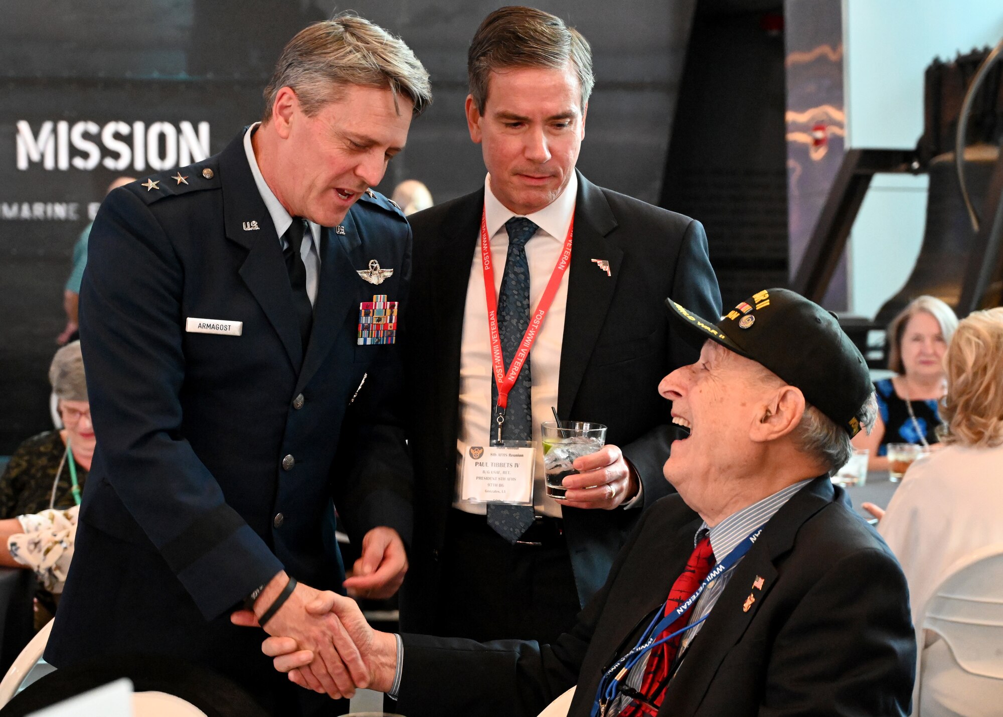 8th Air Force commander shakes hands with a WWII veteran
