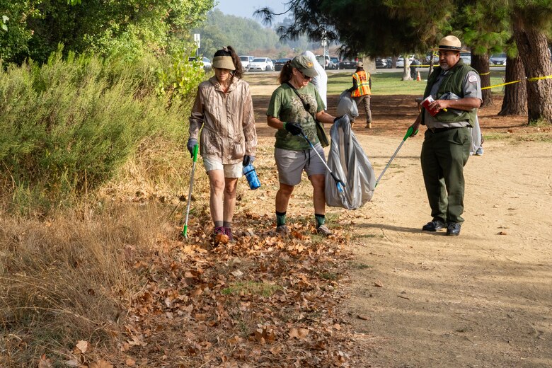 Volunteers pick up litter during a National Public Lands Day event Sept. 28 at Sepulveda Basin in Los Angeles. The U.S. Army Corps of Engineers Los Angeles District, in partnership with the Friends of the Los Angeles River, hosted a National Public Lands Day clean-up event.