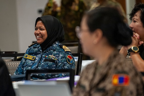 An instructor laughs during the Indo-Pacific Regional Military Gender Advisor Course, Honolulu, Sept. 20, 2024.