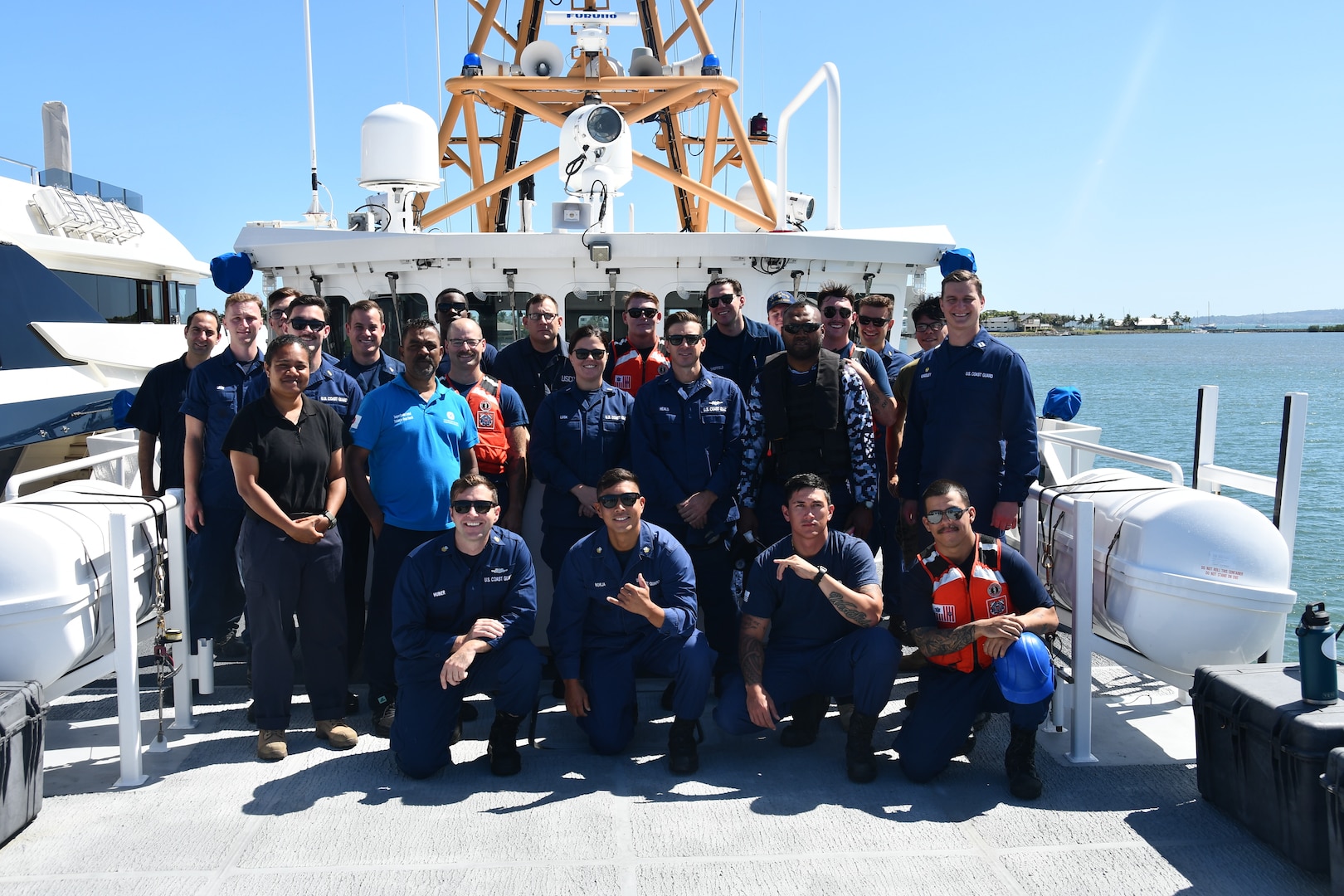 U.S Coast Guard Cutter Oliver Berry (WPC 1124) crew members pose for a photo with members of the Fiji Ministry of Fisheries, Navy, and Revenue and Customs on the bow of the Oliver Henry, Sept. 8, 2024. U.S. Coast Guard Cutter Oliver Berry’s crew recently completed a 45-day patrol in Oceania in support of Operation Blue Pacific, promoting security, safety, sovereignty, and economic prosperity in the region.