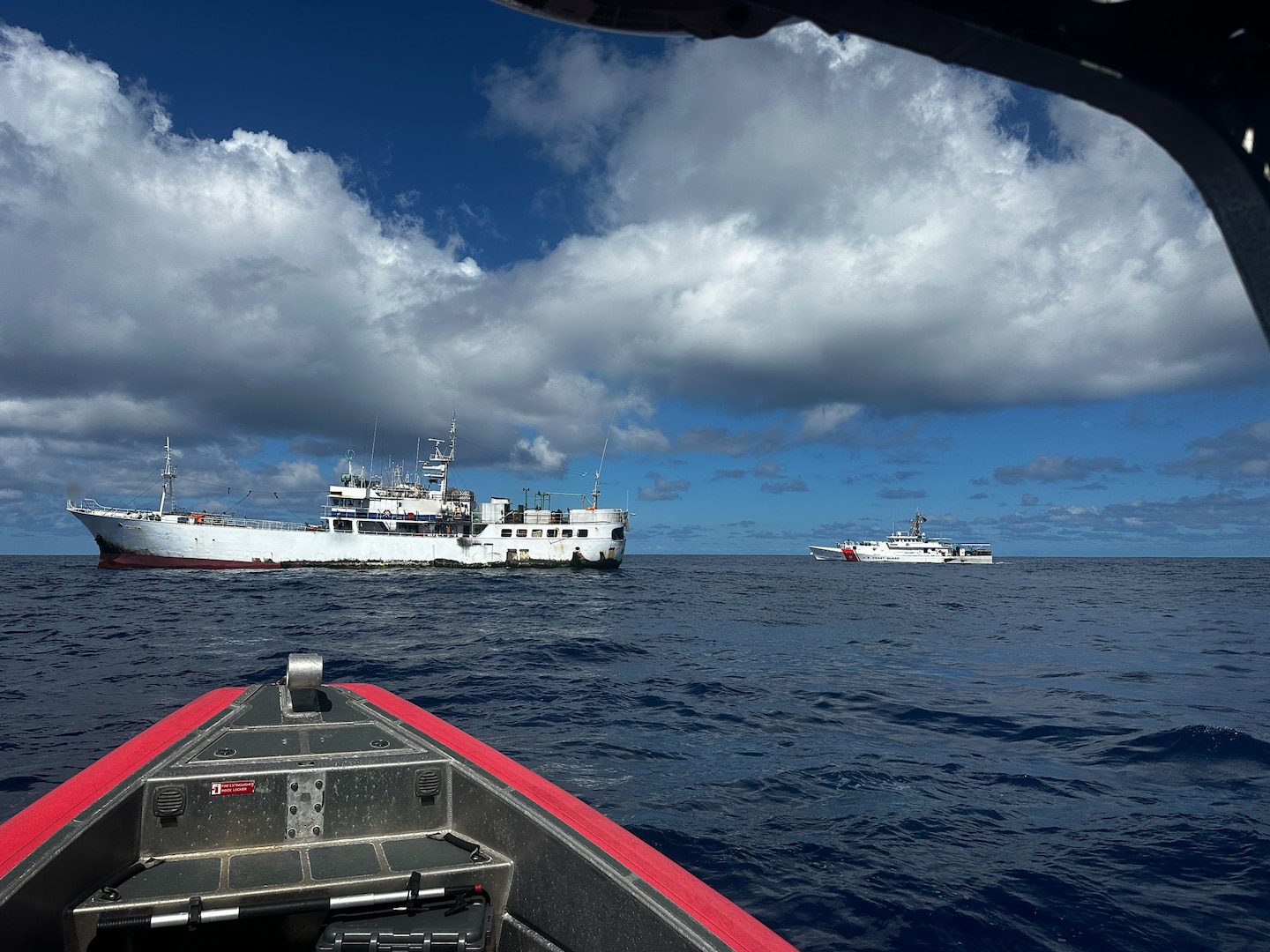 A U.S. Coast Guard boat crew and boarding team from U.S. Coast Guard Cutter Oliver Berry (WPC 1124) approaches a foreign fishing vessel to conduct a joint boarding inspection with members of the Western and Central Pacific Fisheries Commission on the high seas in Oceania, Sept. 22, 2024. U.S. Coast Guard Cutter Oliver Berry’s crew recently completed a 45-day patrol in Oceania in support of Operation Blue Pacific, promoting security, safety, sovereignty, and economic prosperity in the region.