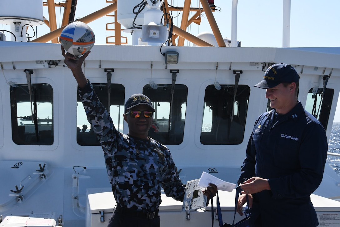 U.S. Coast Guard Lt. Jasen Kingsley, commanding officer of U.S. Coast Guard Cutter Oliver Berry (WPC 1124) bids farewell to a member of the Fjii Ministry of Fisheries, Revenue and Customs Service and Navy on the bow of the Oliver Henry, Aug. 31, 2024. U.S. Coast Guard Cutter Oliver Berry’s crew recently completed a 45-day patrol in Oceania in support of Operation Blue Pacific, promoting security, safety, sovereignty, and economic prosperity in the region.