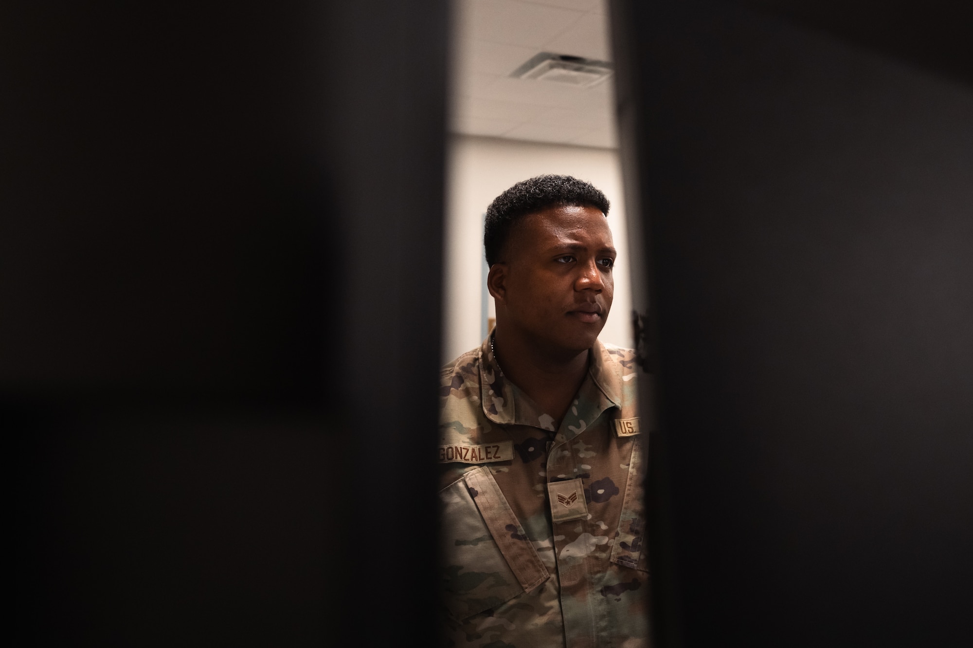 An airman reviews the budget on his computer