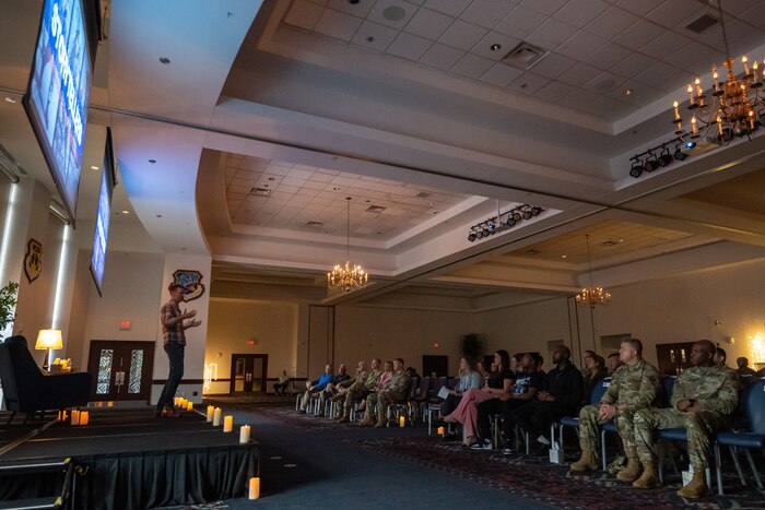Presenter speaks to a crowd at storyteller event.