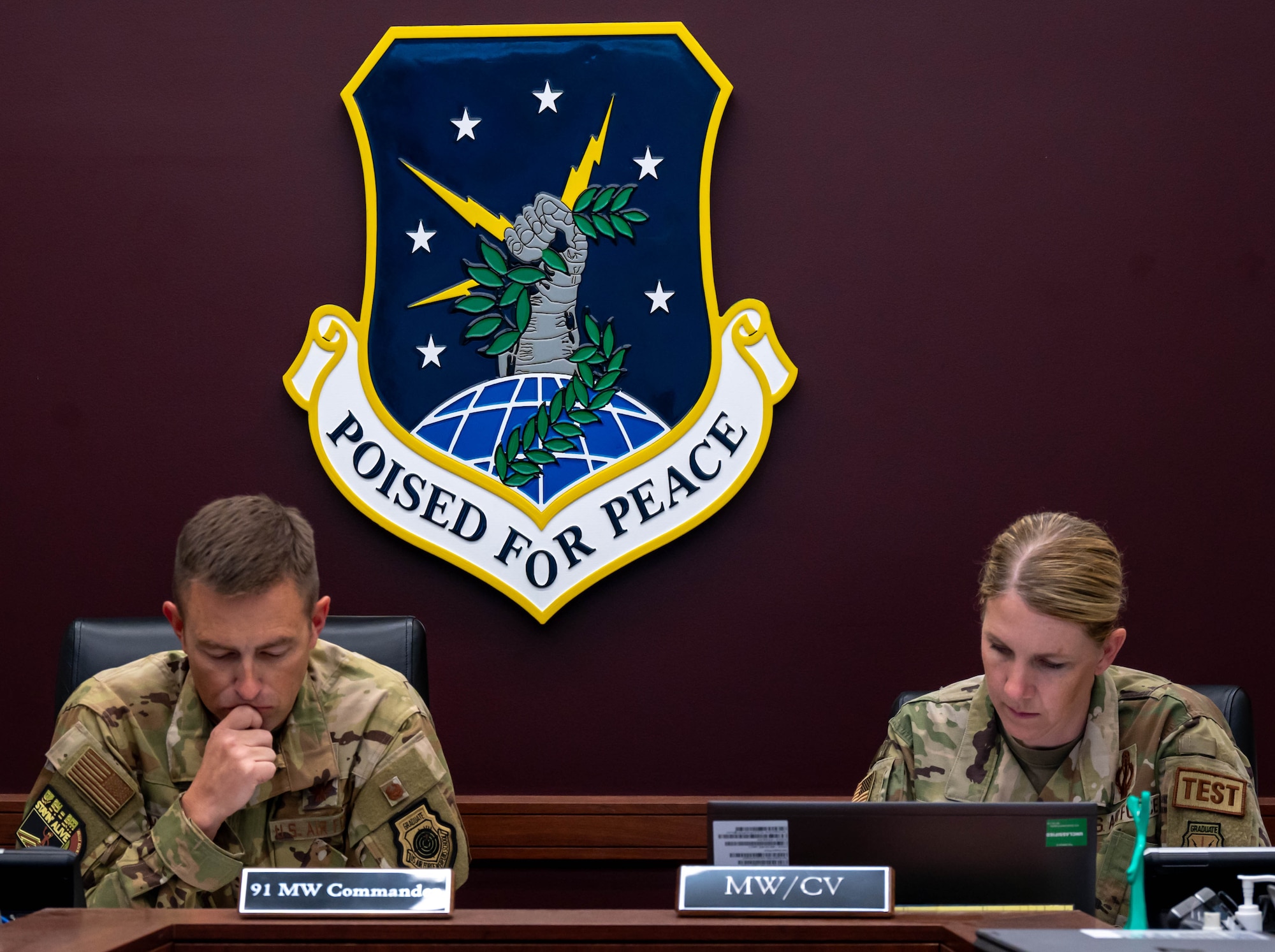 U.S. Air Force Col. George Chapman, 91st Missile Wing commander and Lt. Col. Karrie Wray, 576th Flight Test Squadron director of operations, confirm the safety checklist during the simulated electronic launch of a Minuteman III (SELM) at Minot Air Force Base, North Dakota, Sept. 17, 2024. This evaluation is an end-to-end test that is used to verify the reliability of the MMIII intercontinental ballistic missile (ICBM) system’s ability to launch if given the command from a launch control center (LCC) or an airborne launch control system (ALCS). (U.S. Air Force photo by Senior Airman Alexander)