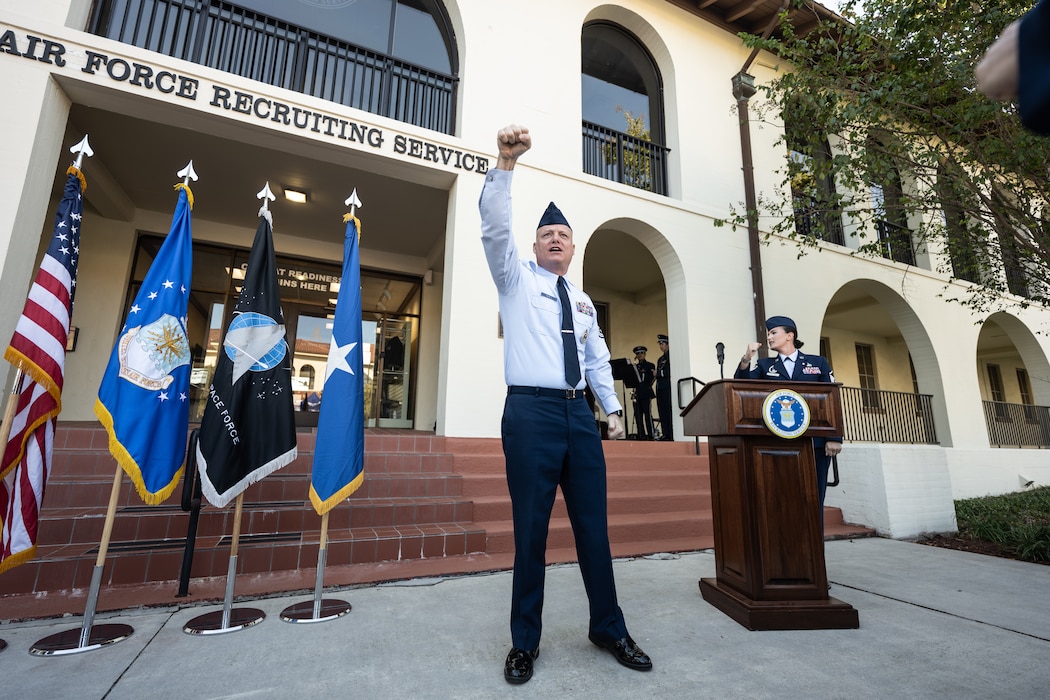 Man stands in uniform cheering