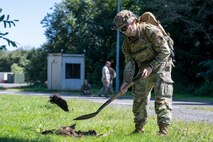 U.S. Air Force Senior Airman Evan McGuire, 35th Civil Engineer Squadron explosive ordnance disposal (EOD) technician, digs a hole to simulate detonating unexploded ordnance.