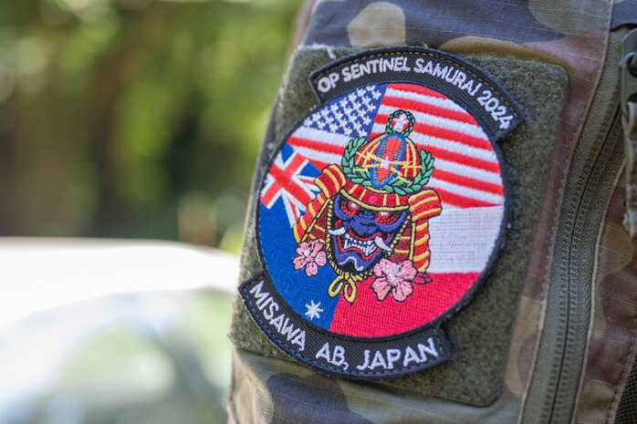 An Operation Sentinel Samurai exercise patch shows the flags of participating nations.