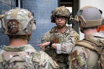 U.S. Air Force Staff Sgt. Sho Kasahara, 35th Civil Engineer Squadron explosive ordnance disposal (EOD) technician, gives instructions to his team before engaging in an explosive vest scenario.