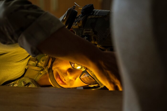U.S. Air Force Staff Sgt. Sho Kasahara, 35th Civil Engineer Squadron explosive ordnance disposal (EOD) technician, inspects a room for booby traps.