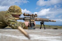 Royal Australian Air Force Flight Sgt. Tristan Crump, explosive ordnance disposal (EOD) observer, fires an M110 Semi-Automatic Sniper System.
